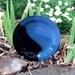 A Blue and Black Stoneware Plate