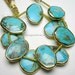 Delicious Blue Turquoise Oval Nuggets with Vermeil Bezel Rim 16X12mm - 1/2 STRAND