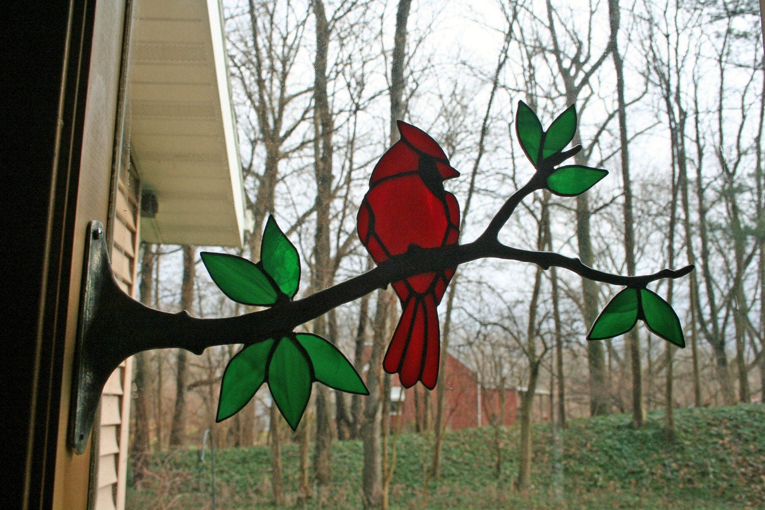 stained glass cardinal on a branch stained glass cardinal on a branch