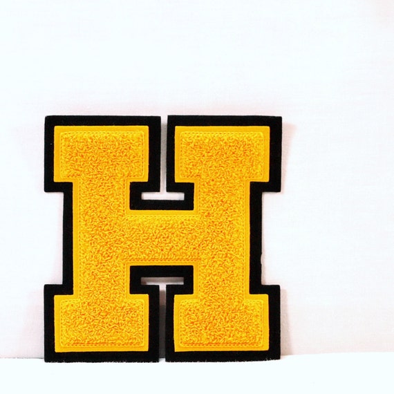 Vintage black and gold letter H high school letterman jacket