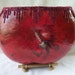 Extra large oxblood gourd bowl on bamboo base with copper wire and buckeye accents. Item 1332.