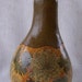 Gourd box, Queen Annes Lace, Dutchmans Breeches leaves, ceramic bead, brass tack. 1558.