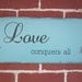 READY TO SHIP - 8" x 15" Wooden sign with vinyl lettering - Love conquers all