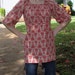 red damask print top with bell sleeves