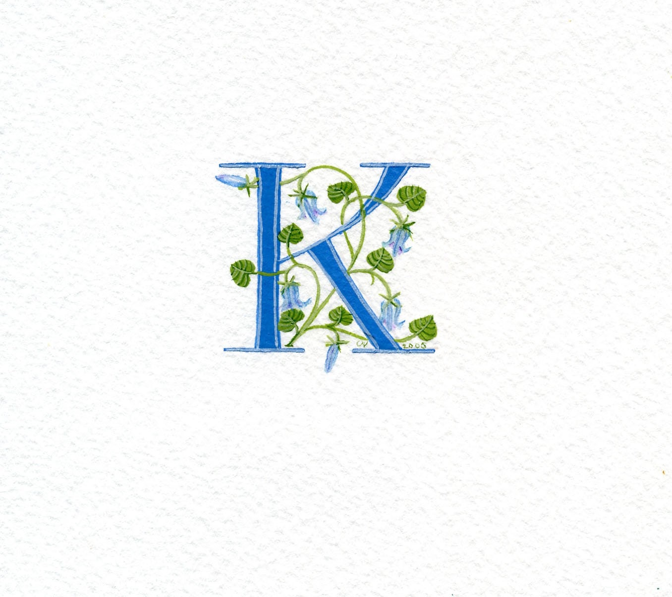 Custom initial letter K in turquoise with bluebells.