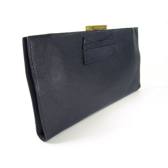 Navy leather clutch MIU MIU Navy leather clutch with gold detailing. I purchased this bag on trueiupnbp.gq for approx $ The bag is in excellent condition. The clutch is 28cm long and 17cm in height. Seller assumes all responsibility for this listing. Postage and handling.