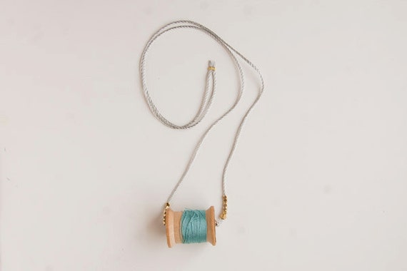 Vintage blue wooden spool necklace with sparkle