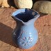 Wheel thrown, Blue Vase with an incised Flower Vine Design