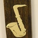 Exotic wood Money clip with brass saxophone Inlay.