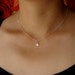 Tiny Sterling Silver Starburst Charm Necklace