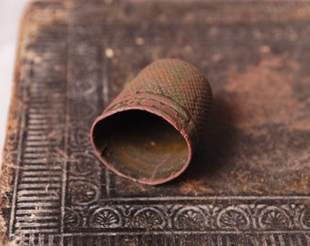 Antique big brass thimble. Black patina