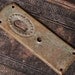 Vintage Art Nouveau style key hole escutcheon .