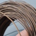 5 feet of Vintage brass notched flat wire, original dark patina, soft. From 1960s