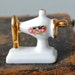 Vintage porcelain figurine. Miniature sewing machine