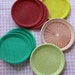 Rainbow Assortment of Vintage Plastic Plate Holders, Set of 16