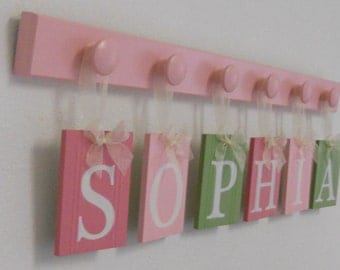Wooden Letters Nursery Includes Childrens Names Wood Hooks in Pink and Light Pink and Light Green. Custom Kids Wall Art