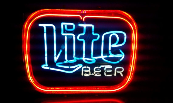 Vintage Neon Miller Lite Sign With a Blue Neon Glow