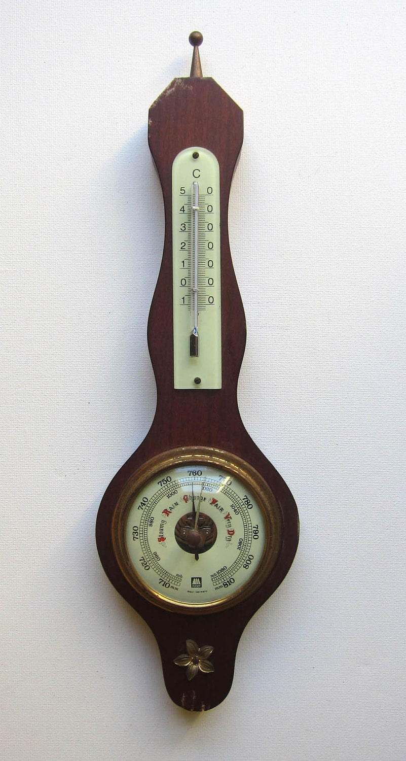 Vintage colonial style barometer and thermometer