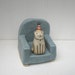 Happy Cat in Party Hat Sitting on Chair Ceramic Sculpture 1