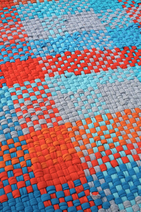 Rag rug from recycled t-shirts hand woven orange aqua and