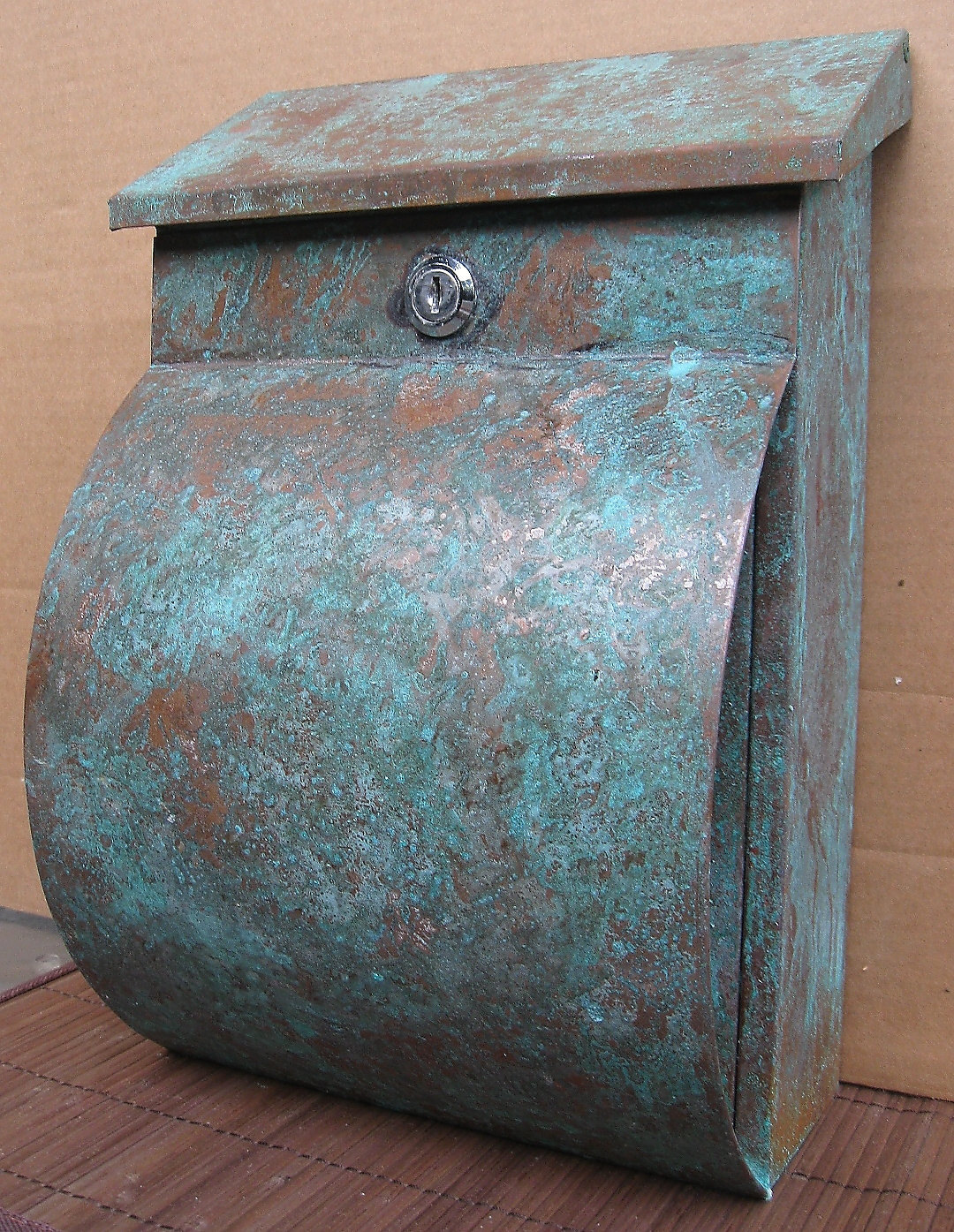 Green patina copper mailbox with newspaper holder