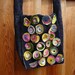 Dot.com: a denim cross-body with colorful fabric dots and buttons