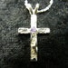 Sterling silver cross pendant with amethyst accent (the birthstone for February)