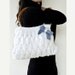 White hand knitted hand BAG with blue bow