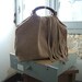 Fringed Tassel Handbag with Boho Chic Style. Vintage chain detail.
