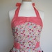 Retro apron with bow, Vibrant colour floral, polka dots coral fabric, 1950s vintage inspired, fully lined.