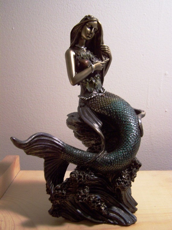 bronze mermaid figurine