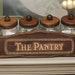 Set of 4 Glass Canisters with Wooden Lids and Wooden Rack