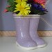 Purple ceramic rain boots of white polks dots with yellow red purple pink daisies