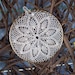 Delicate eye-catching crochet window or wall hanging with a small crystal