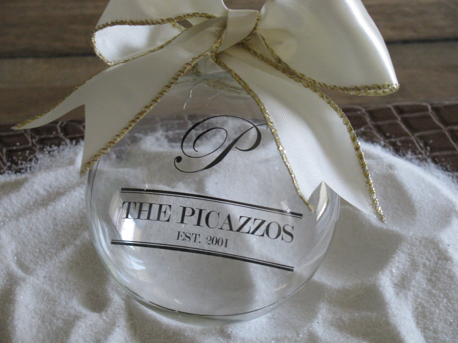 Glass ornament personalized with your family name