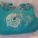 Clearance 50%off Turquoise Hand Knit felted wool Fiber Art bag with needlefelted floral motif and novelty yarn