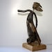this is "Storm" a driftwood sculpture... made from natural driftwood on a marble stand, so the storm can't sweep her away...free shipping...