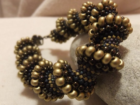 Tubular peyote beaded bracelet in olive and purple tones