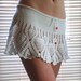 Hand crochet summer beach mini skirt in white color docorated with red crystal beads