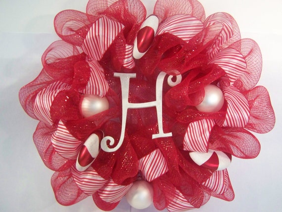 Items similar to Christmas candy cane wreath with initial on Etsy