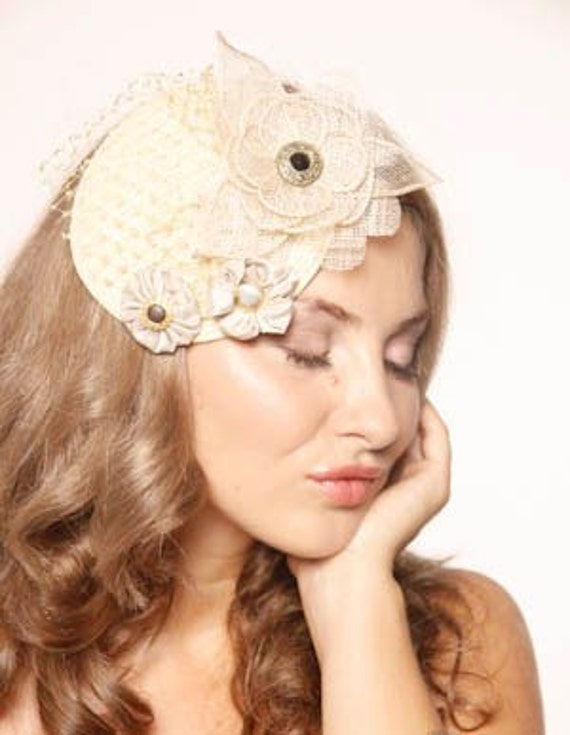 Items similar to Stunning Ivory fascinator with sinamay and silk hand