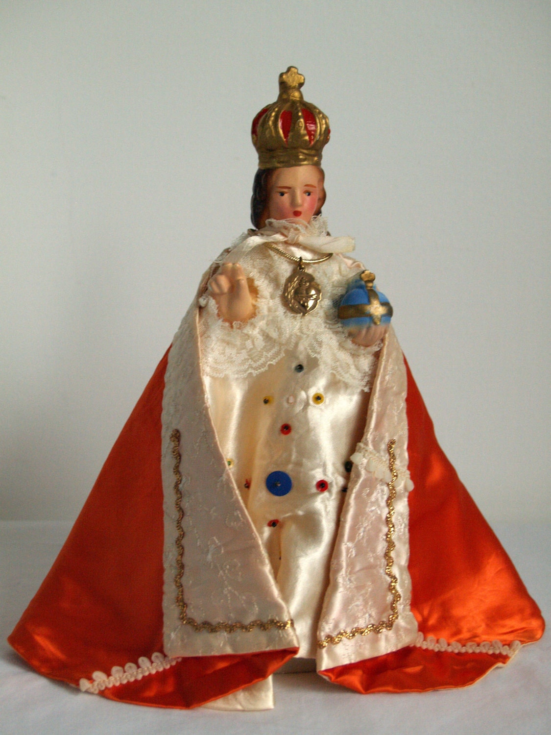 Infant of Prague statue. Silk gown and cloak. 11 inch