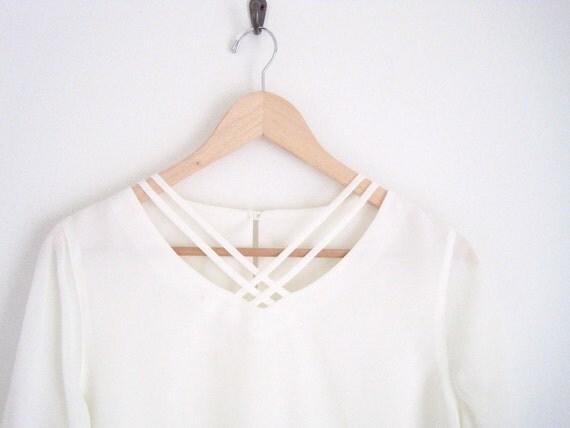 criss cross neckline shirt