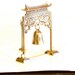 Brass Meditation Gong Bell with Stricker, has a Pagota and chinese pavilion enbossed in it