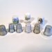 Assortment of nine Thimbles, some German made, and Bone China.