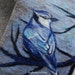 Practical, original and comfortable scarf with blue bird felted on it.