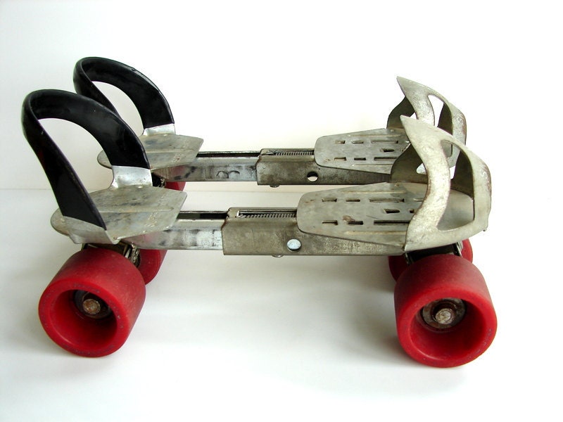 Vintage Adjustable Metal Roller Skates with Red Wheels Home