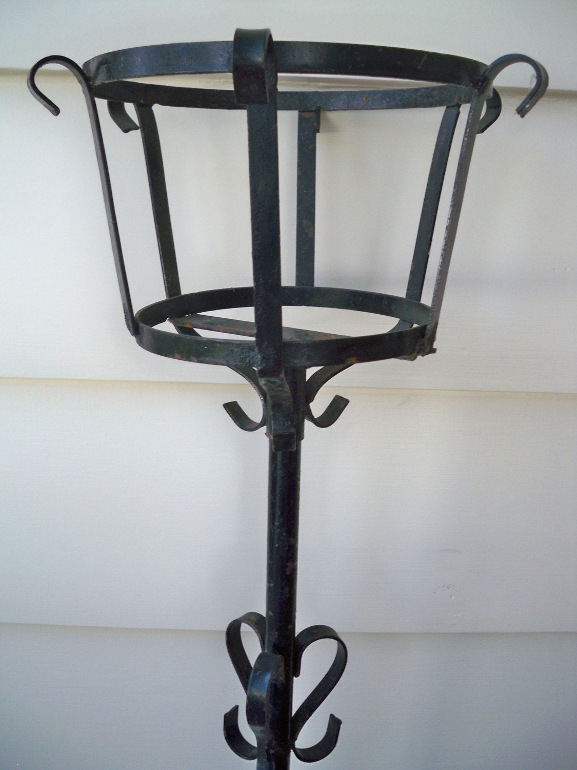 Vintage black wrought iron plant stand
