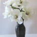 Silk Floral Arrangement In A Black Vase With White Flowers