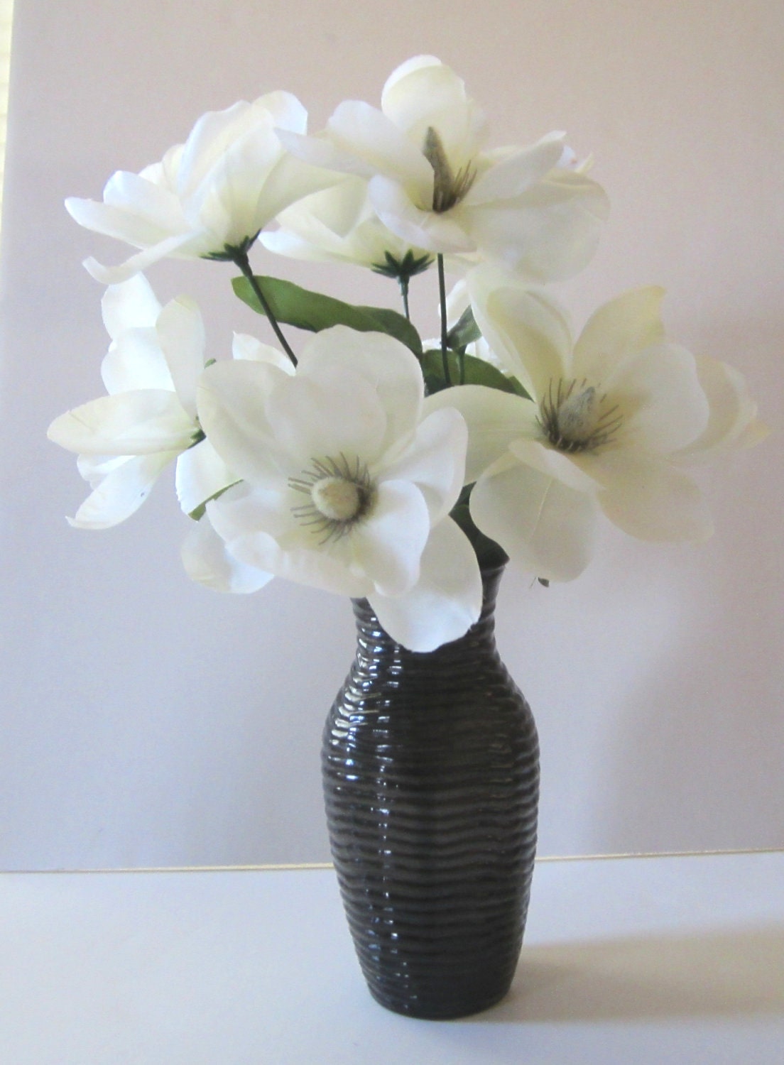 Silk Floral Arrangement In A Black Vase With White Flowers